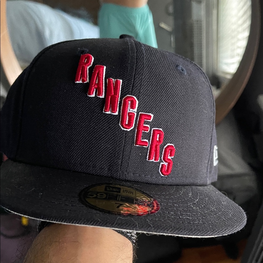 New Era size 7. Rangers Black Cap with Red Lettering